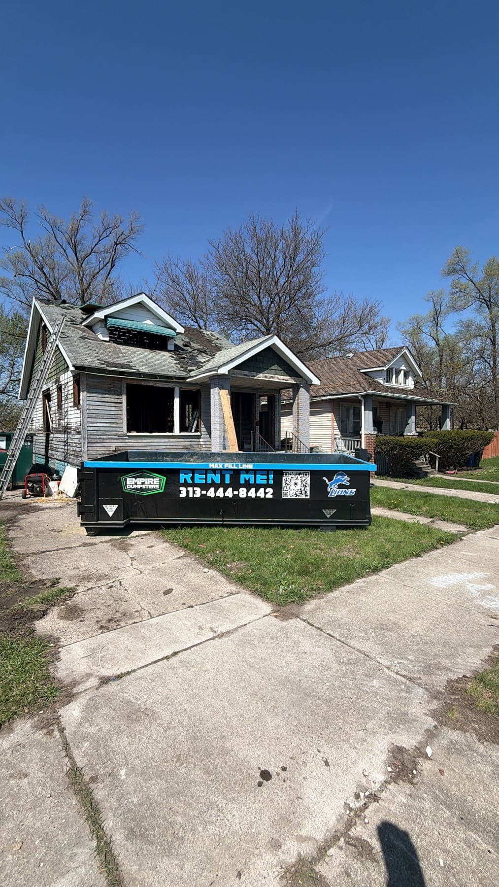 Empire Dumpsters roll-off dumpster on the job in Metro Detroit